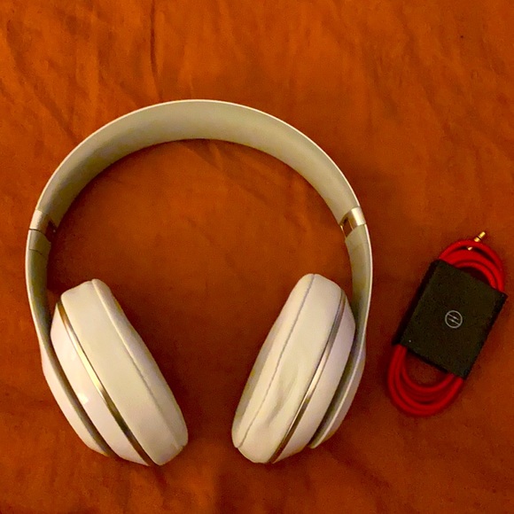 Beats sound/noise cancelling headphones: white with red ascents.